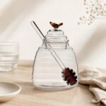 Pojemnik szklany na miód z łyżką 450 ml Pszczółka bursztynowy